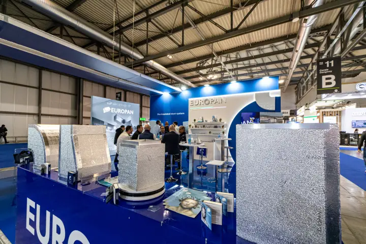 Europan pre-insulated duct samples on a blue counter at MCE 2024