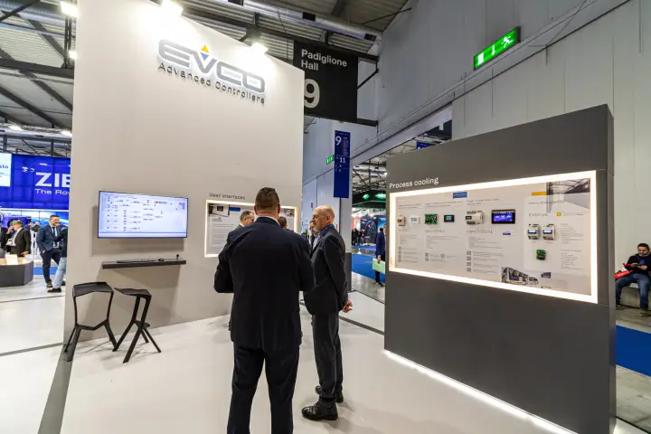 EVCO Advanced Controllers wall with software screen and process cooling panel at MCE 2024