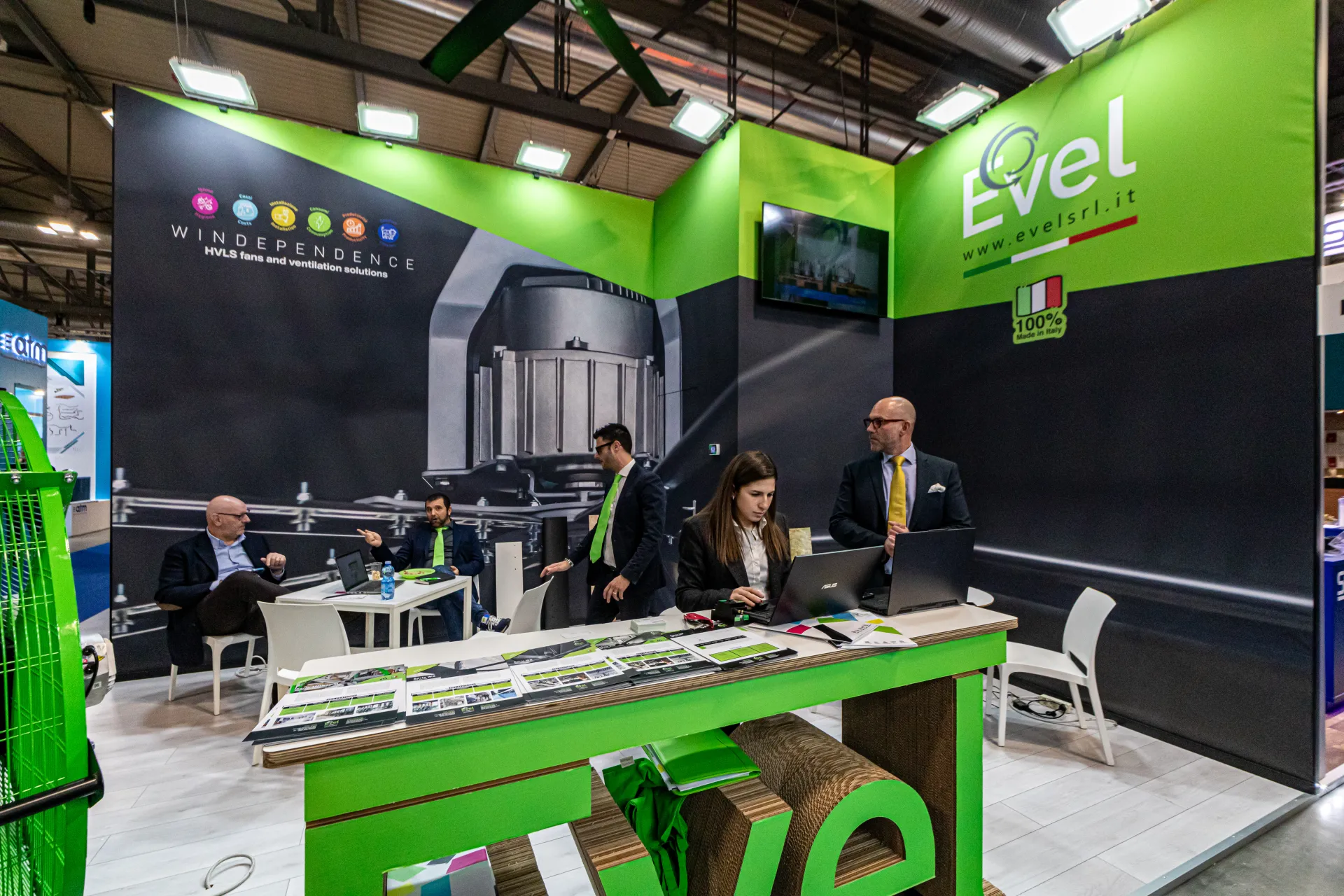 Evel 'Windependence' stand with HVLS fan graphics and green counter at MCE 2024