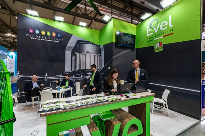 Evel 'Windependence' stand with HVLS fan graphics and green counter at MCE 2024