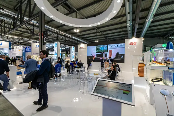 Feinrohren and Zetaesse stand with copper tube displays and LED wall