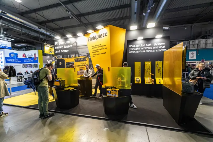 Fieldpiece yellow and black stand with HVACR service tools at MCE 2024