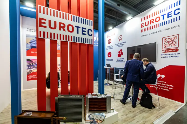 Finned coil heat exchangers in front of Eurotec's red slatted wall