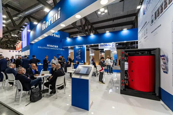Fiorini stand with an R290 heat pump hydronic module and busy meeting tables at MCE 2024