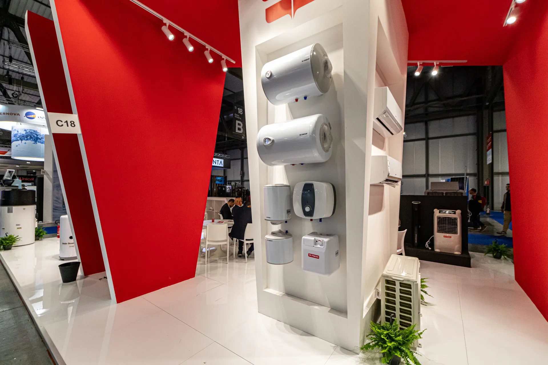 Fresh water heater column with split air conditioners under red angled walls at MCE 2024