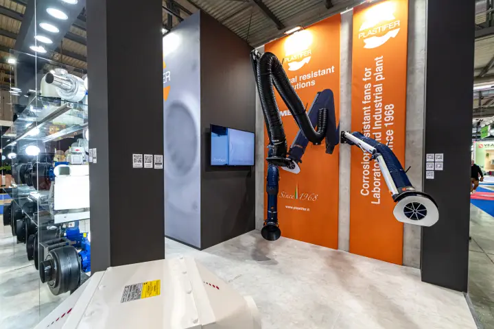 Fume extraction arms on Plastifer's orange laboratory fan panels