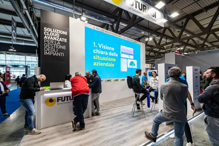 Futurasi stand presenting Unico3 cloud software on a large LED wall