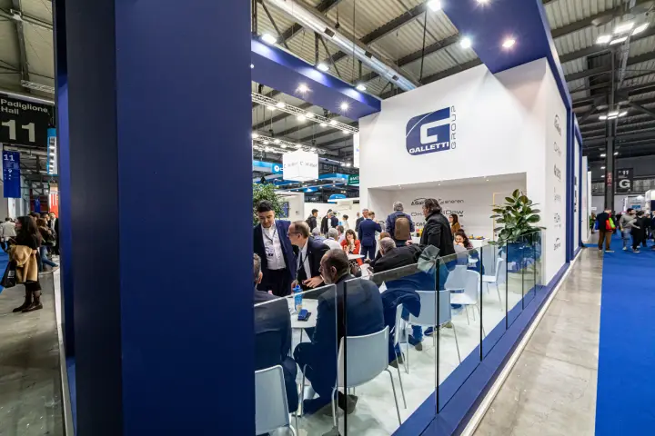 Galletti Group lounge behind a glass balustrade, full of meeting visitors