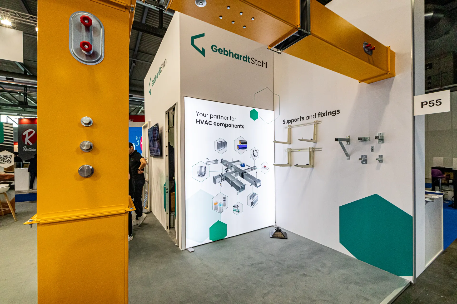 Gebhardt Stahl wall of supports and fixings beside a yellow duct frame at MCE 2024