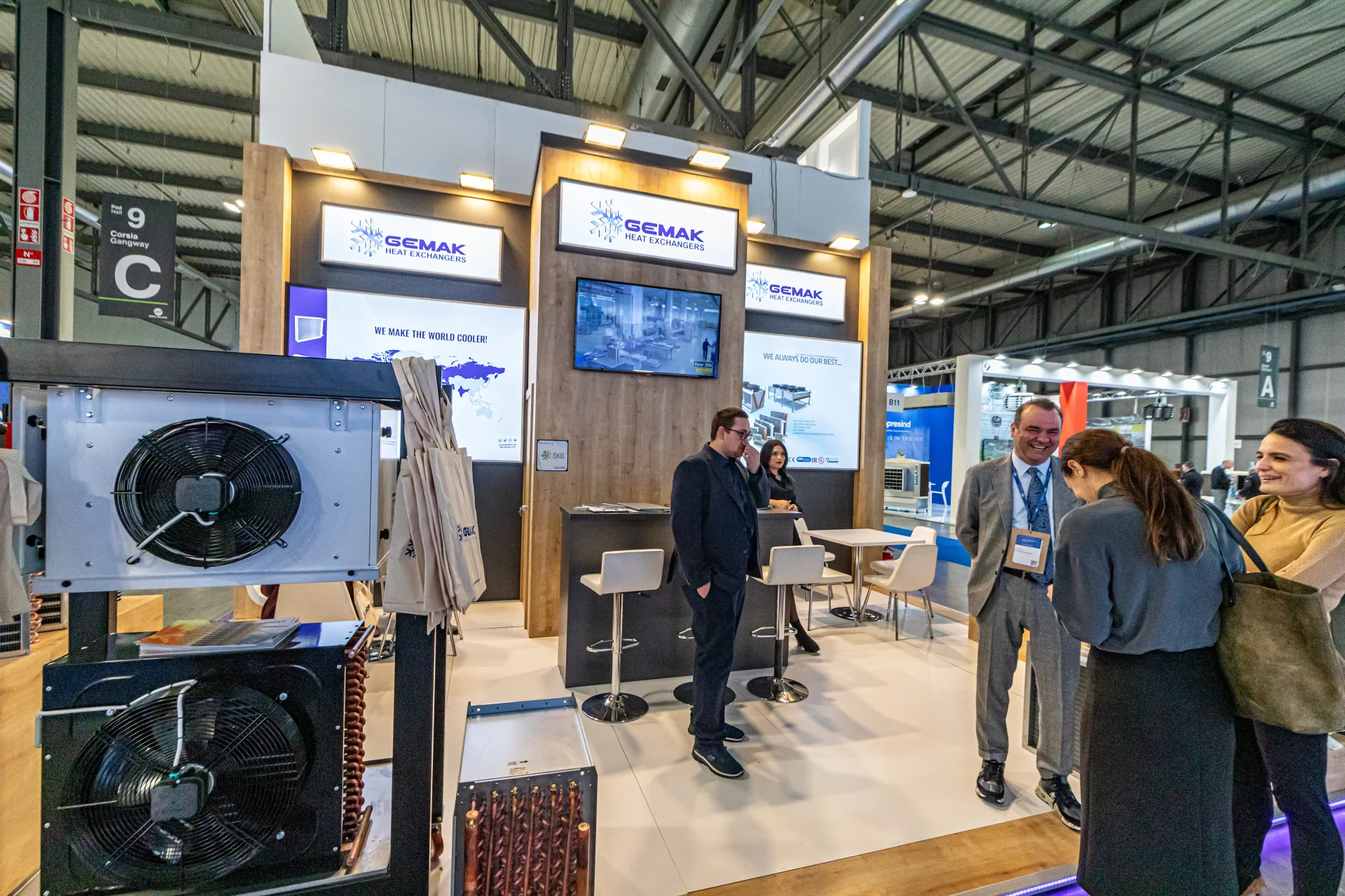 Gemak Heat Exchangers stand with fan-equipped units and a copper-tube coil by the aisle at MCE 2024