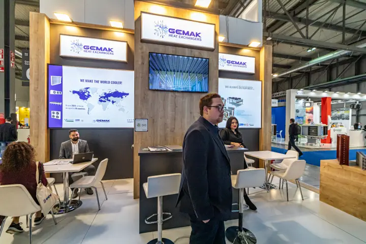 Gemak meeting area with world export map and factory video screen at MCE 2024