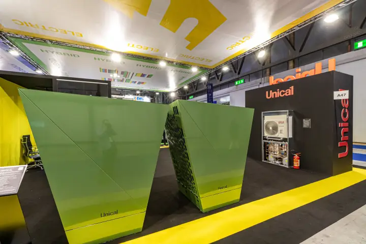 Green faceted Unical units and outdoor unit with exposed hydronic module