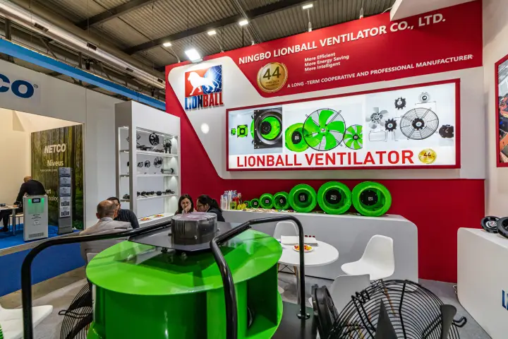 Green Lionball plug fan in front of the red company fascia at MCE 2024