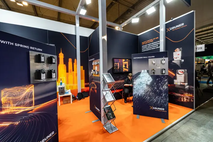 Gruner stand with actuators, motorized ball valves and orange carpet at MCE 2024