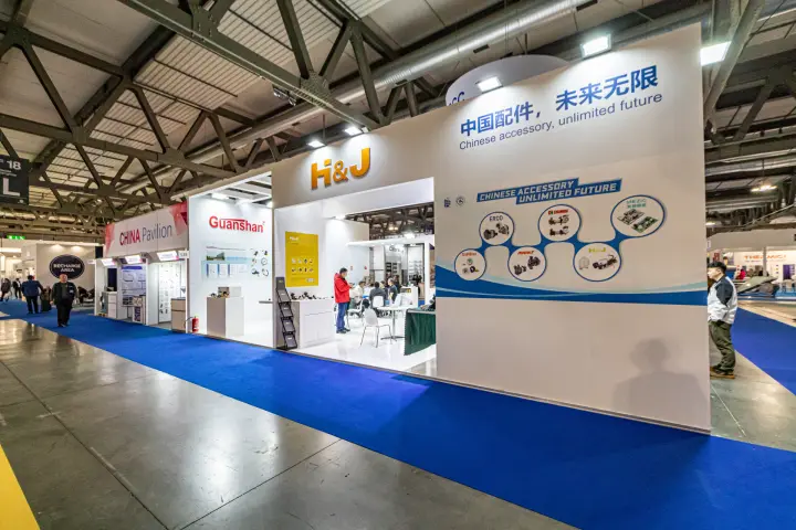 H&J stand with 'Chinese accessory, unlimited future' wall beside Guanshan at MCE 2024