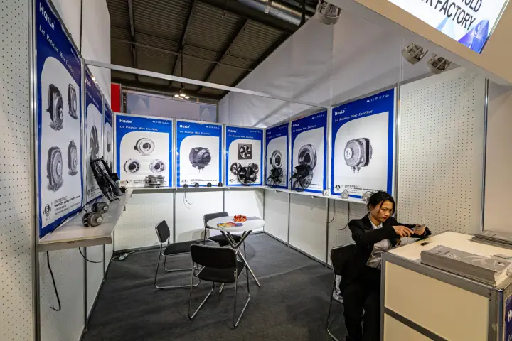 Haile shell-scheme booth with fan motors and fan posters