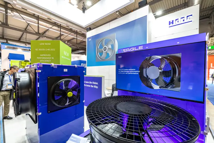 Hidria EAGLE axial fans with grille guards on a purple display at MCE 2024