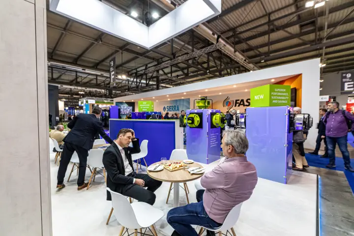 Hidria meeting tables with fan display columns facing the aisle at MCE 2024