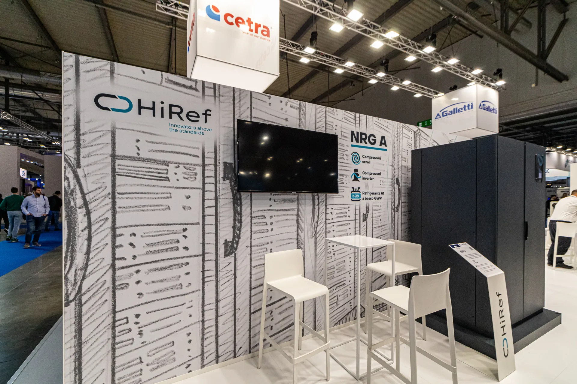 HiRef 'NRG A' display with sketched wall graphics and a dark cabinet unit at MCE 2024