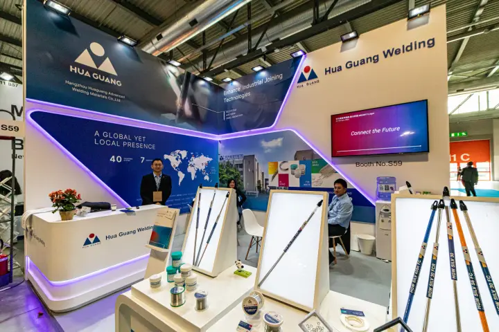 Hua Guang Welding booth S59 with silver brazing rods on lit displays