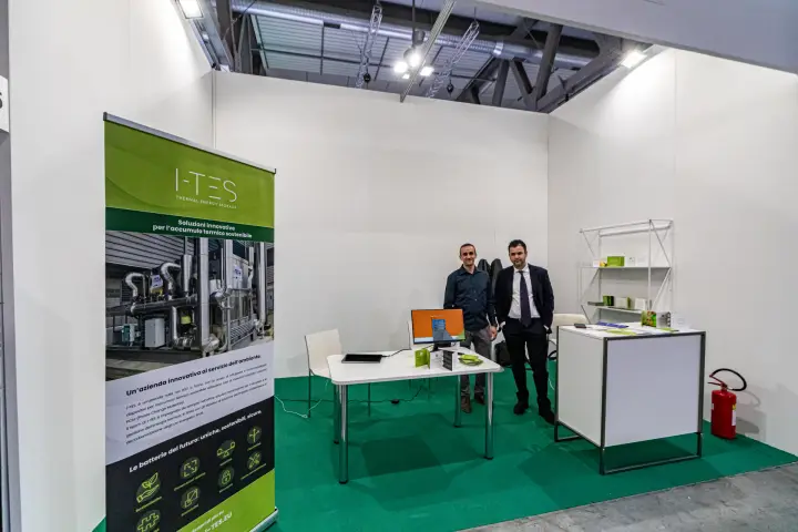 i-TES thermal energy storage booth with green carpet and roll-up banner at MCE 2024