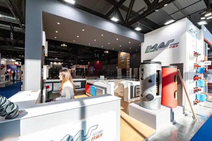 IMAS Group stand with storage tanks, coloured radiators and pump wall at MCE 2024