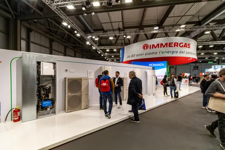 Immergas heat pumps and open in-wall cabinet under the 60-year ring banner at MCE 2024