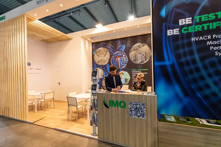 IMQ testing stand with wood slats and 'Be Tested Be Certified' wall