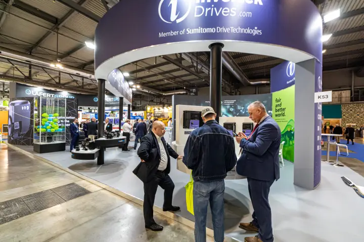 Invertek Drives stand with drives on display under a circular header at MCE 2024
