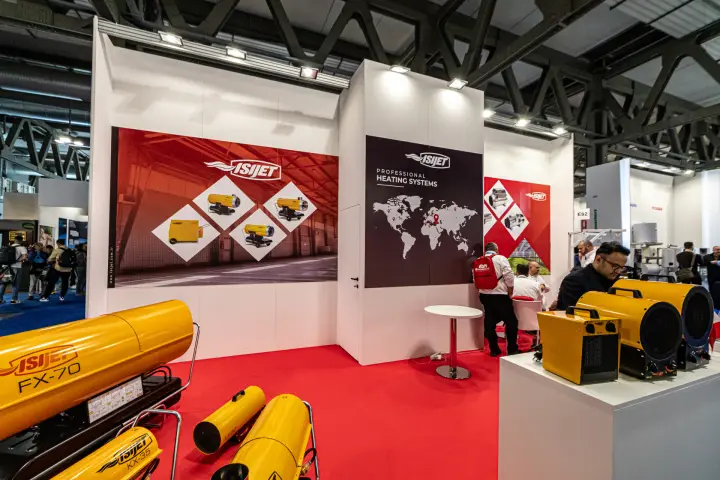 Isijet FX-70 and KX-35 heaters on red carpet with electric fan heaters