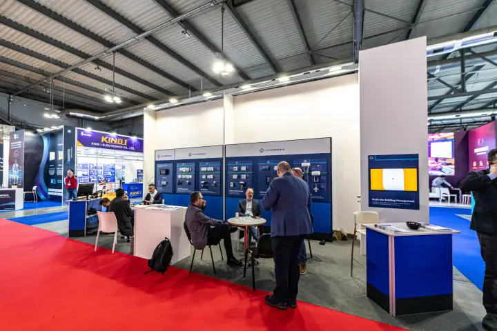 iSMA Controlli stand with HVAC control modules on blue display boards at MCE 2024