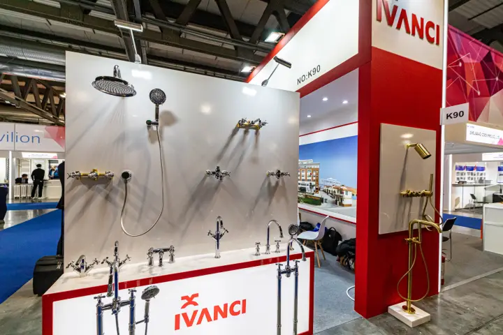Ivanci display wall of chrome and brushed-gold shower sets and taps