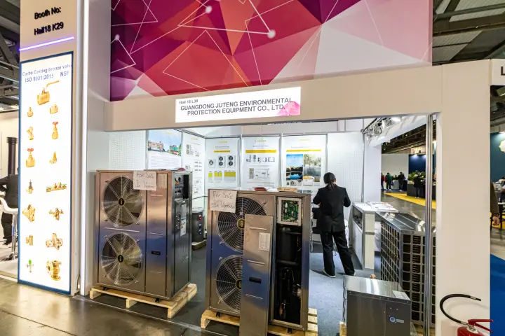 Juteng shell-scheme booth with air-source heat pumps, one with open casing at MCE 2024