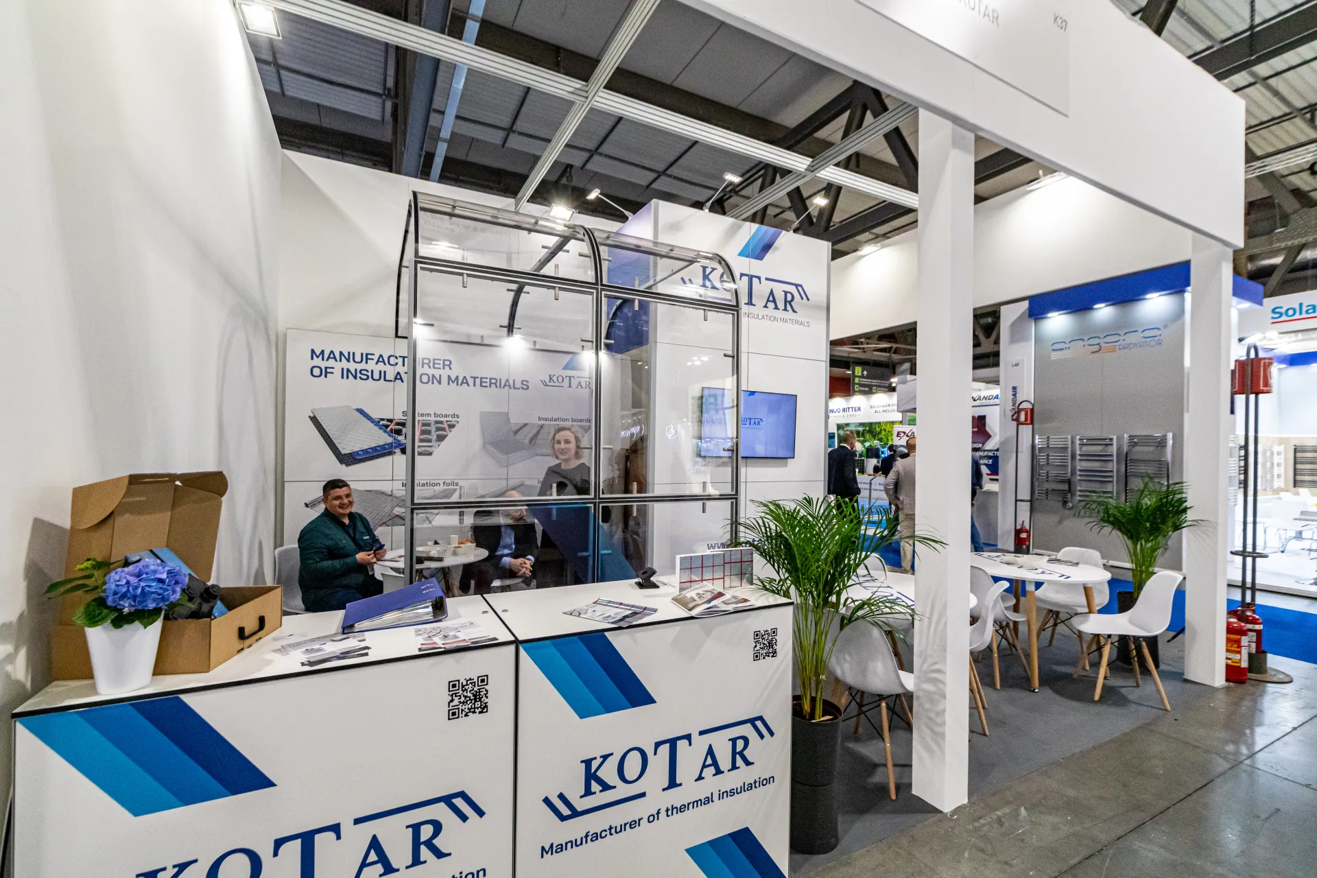 Kotar reception counter with insulation board posters at MCE 2024