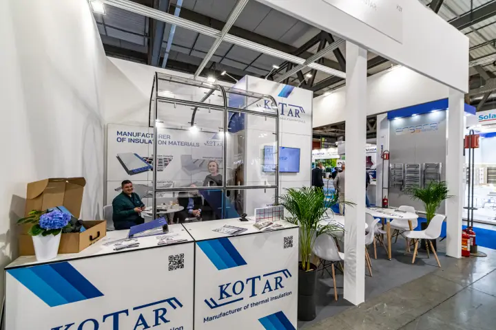 Kotar reception counter with insulation board posters at MCE 2024