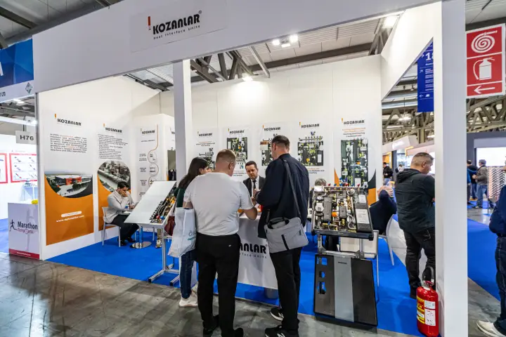 Kozanlar heat interface units on display, visitors at the counter at MCE 2024