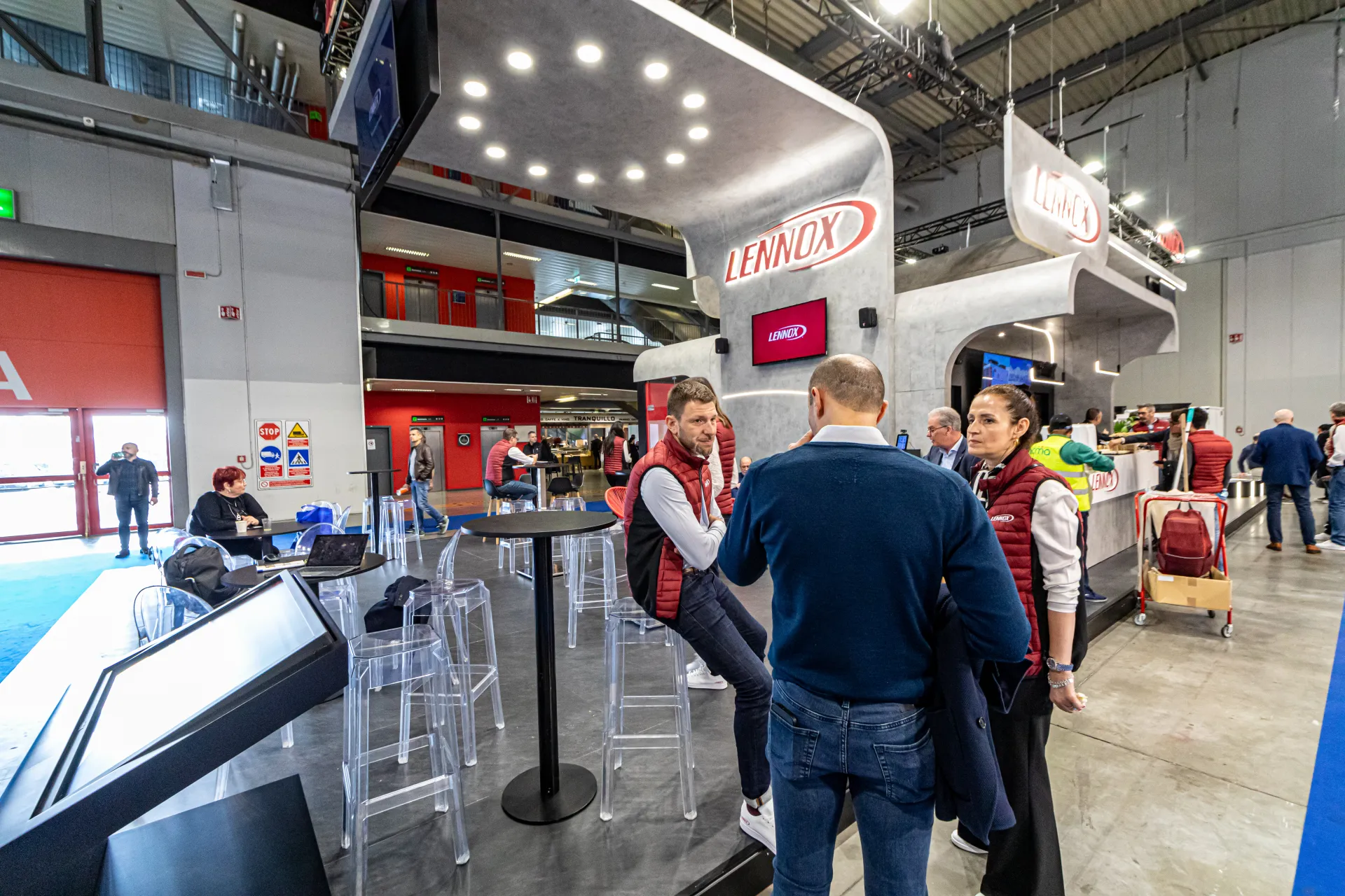 Lennox stand with touchscreen kiosk and high-table meeting area at MCE 2024
