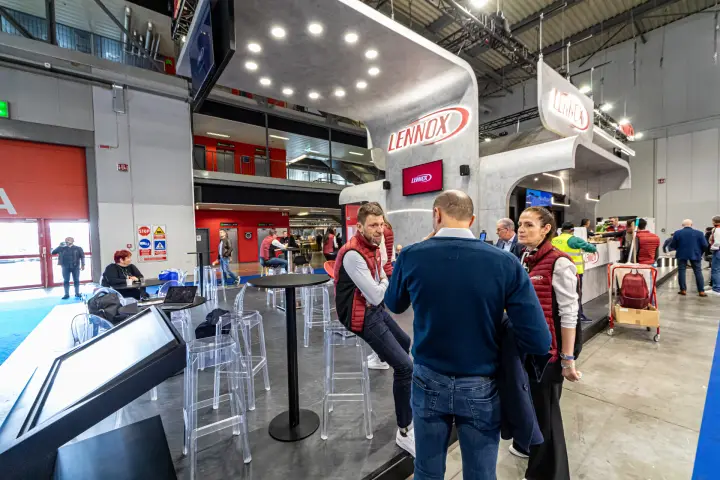 Lennox stand with touchscreen kiosk and high-table meeting area
