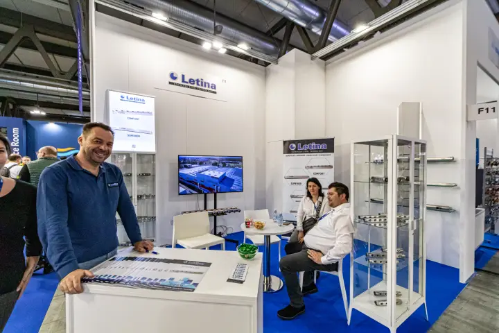 Letina stand with stainless steel manifolds in glass display cabinets at MCE 2024