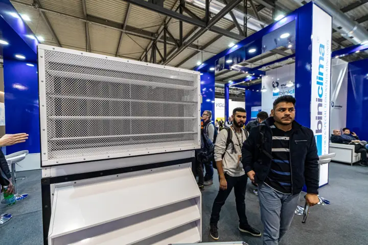 Louvred unit with mesh grille in front of the backlit Biniclima column at MCE 2024