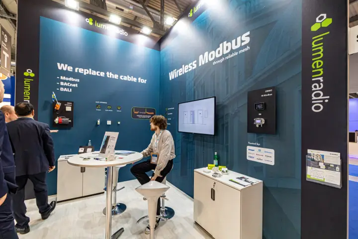 LumenRadio W-Modbus demo panel and 'Trusted by' partner logo plate at MCE 2024