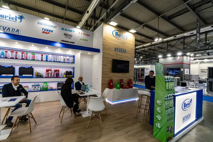 Mariel stand shelves of refrigerant cans, tool cases and service kits at MCE 2024