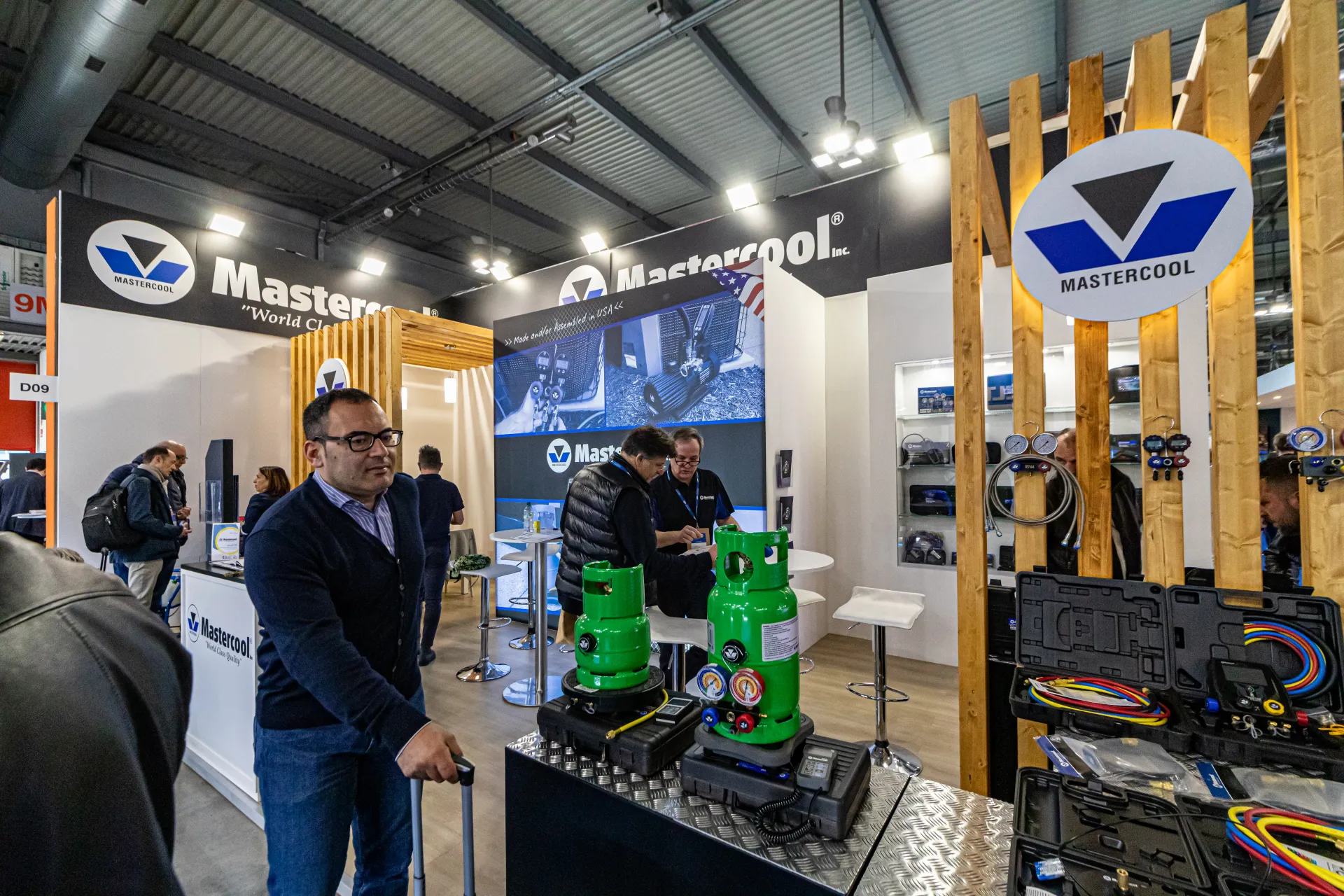 Mastercool refrigerant scales and manifold kits on a checker-plate counter at MCE 2024