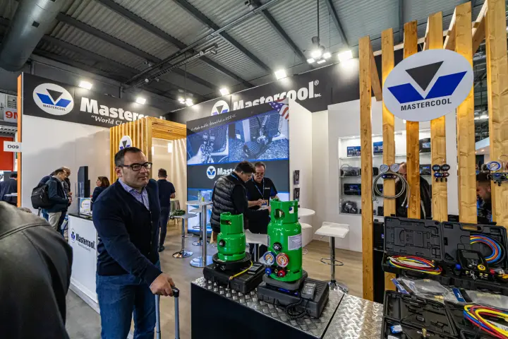 Mastercool refrigerant scales and manifold kits on a checker-plate counter at MCE 2024