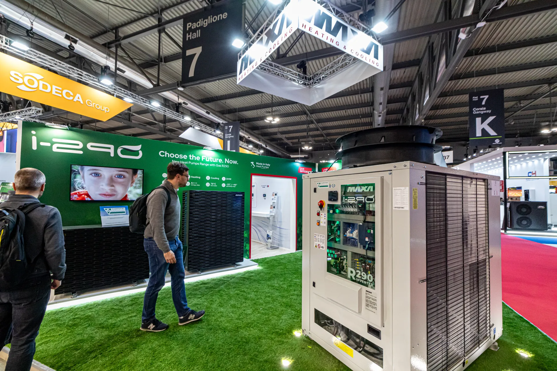 Maxa i-290 R290 heat pump range with a glazed-front unit on green turf at MCE 2024