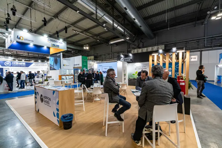Meeting area at the Nippon Gases stand under the energy efficiency wall