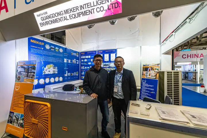Meker booth with an orange-grille heat pump and split air conditioners at MCE 2024