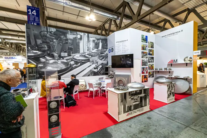 Metalpress stand with pressed steel tank heads on white plinths
