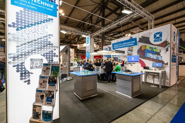 MEZ-Technik stand with blue-topped duct display counters