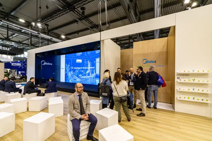 Midea presentation area with LED wall and white cube seating at MCE 2024